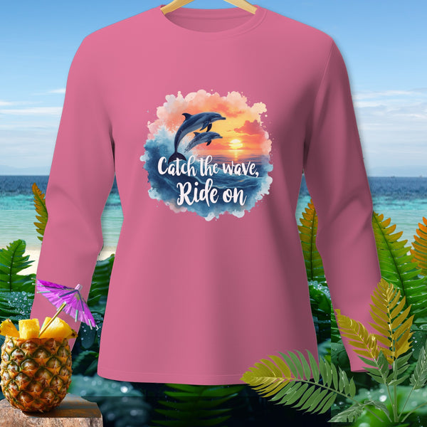 Pink long sleeve shirt with dolphins and "Catch the wave, Ride on" text.
