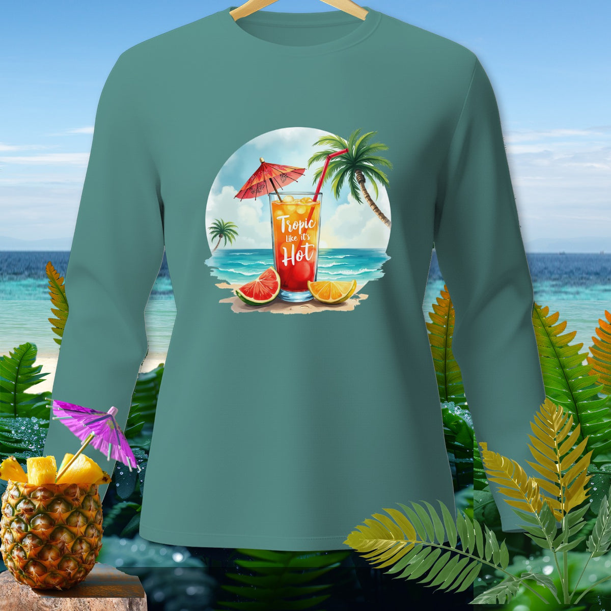Teal long-sleeve shirt with "Tropic like it's Hot" text on tropical drink graphic.
