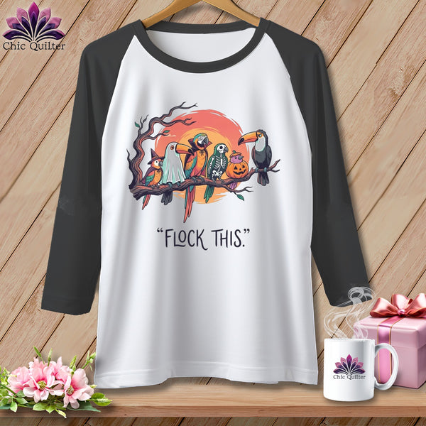 T-shirt with birds dressed in Halloween costumes and the text "FLOCK THIS."