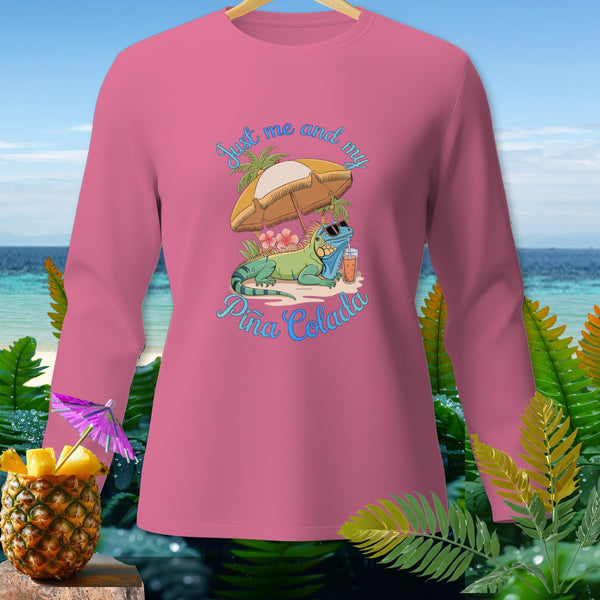 Pink long sleeve shirt with an iguana, umbrella, and "Just me and my Piña Colada" text.