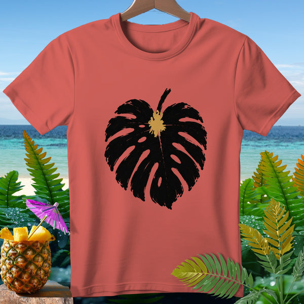 Coral t-shirt with black monstera leaf graphic and tropical background.