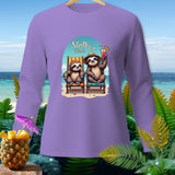 Purple long-sleeve shirt with two sloths relaxing on a beach with text 
