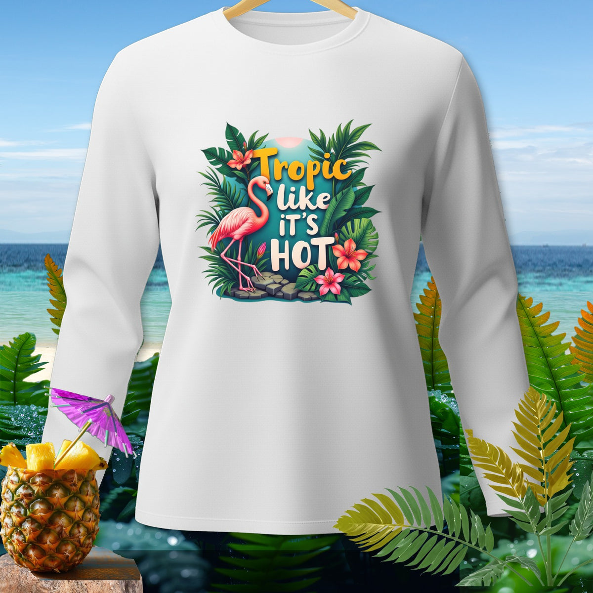 White long-sleeve shirt with flamingo and "Tropic like it's HOT" tropical graphic.