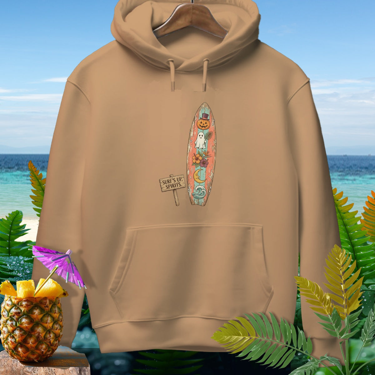 Tan hoodie with a surfboard graphic featuring Halloween and beach elements.