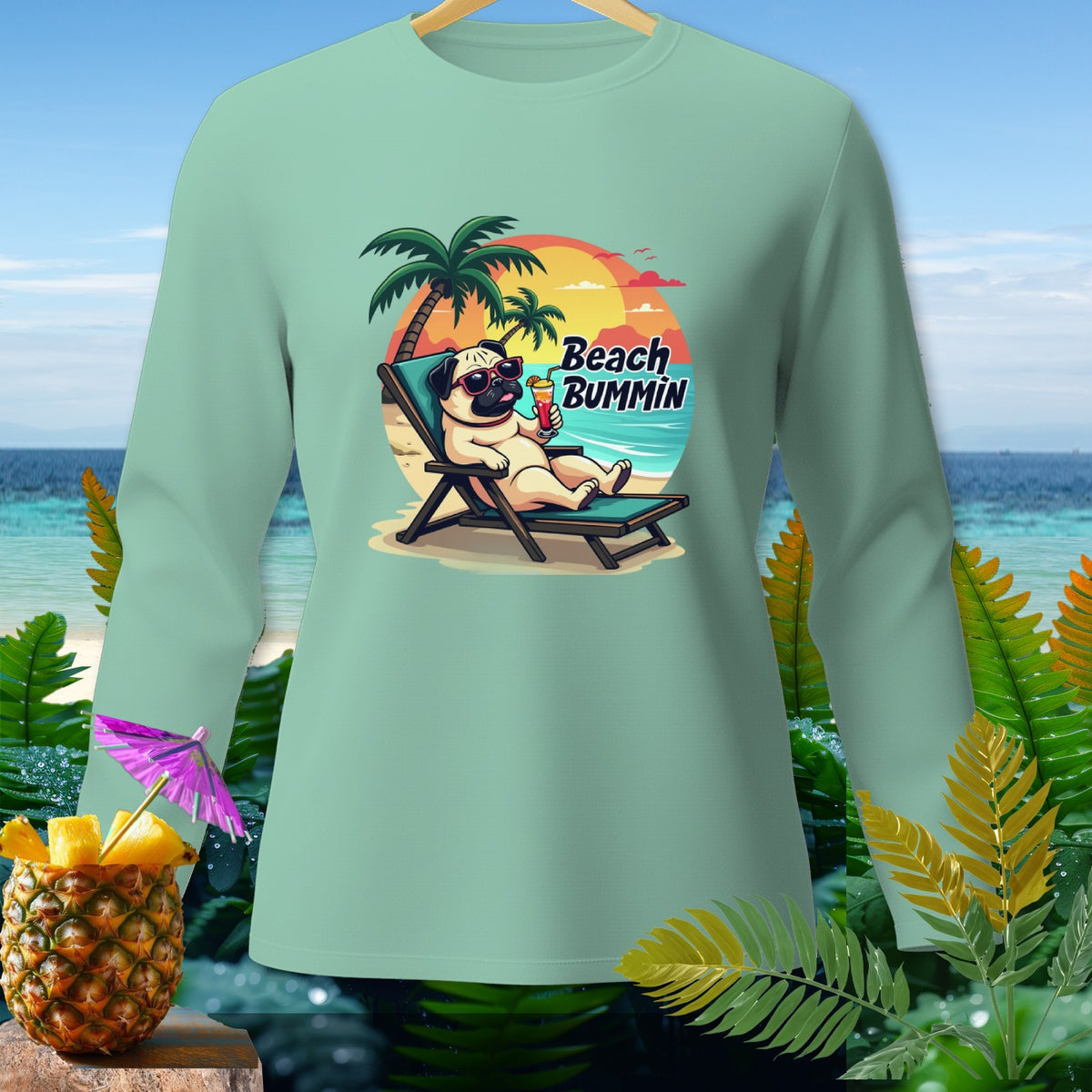 Mint green long-sleeve shirt with pug on beach chair, "Beach BUMMIN" text.