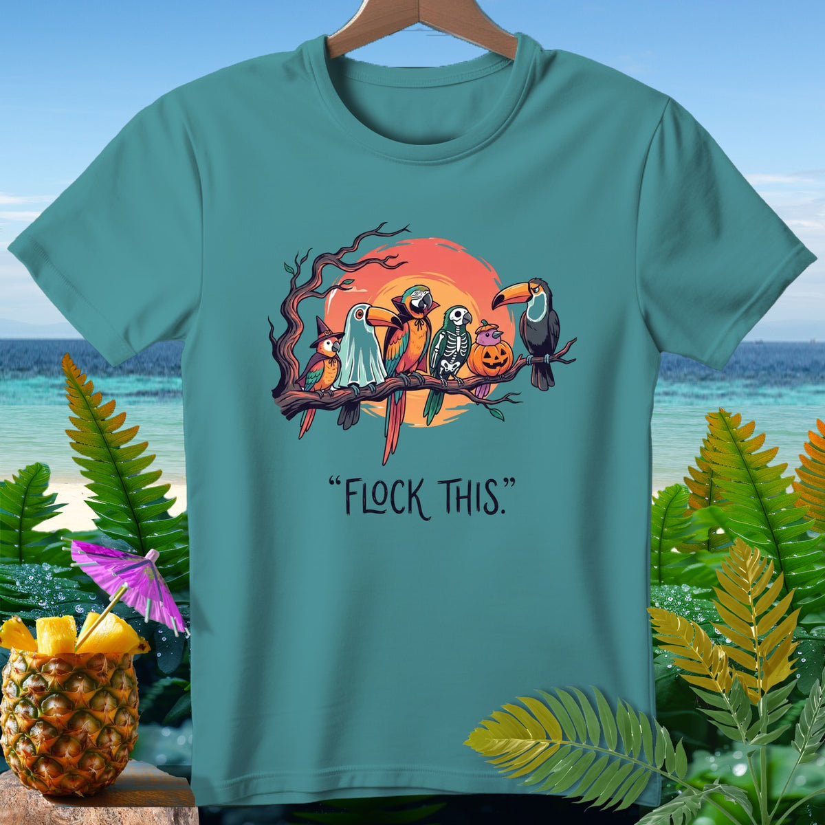 Parrots in Halloween costumes on a branch with text "FLOCK THIS."