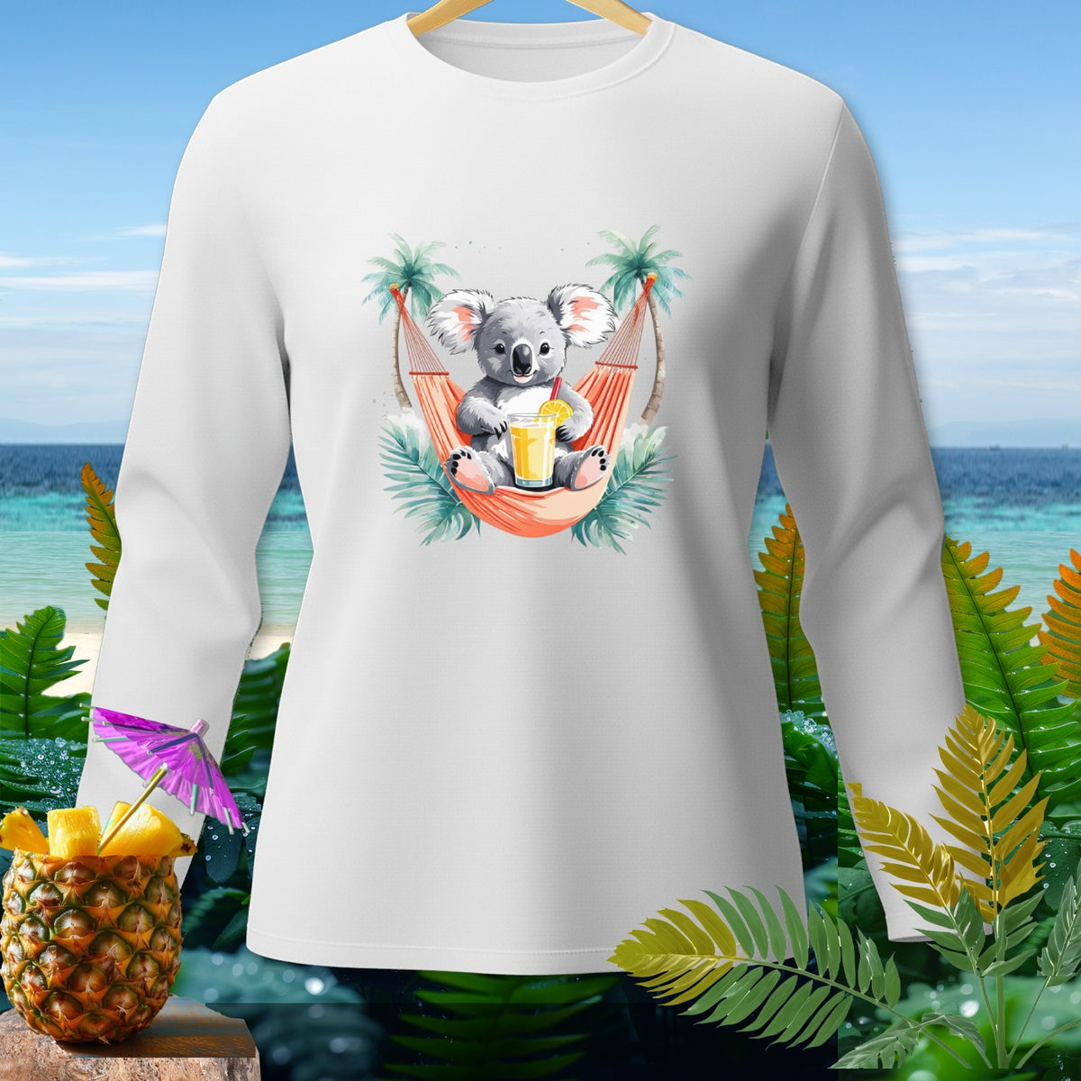 White long-sleeve shirt with a cartoon koala in a hammock holding a drink.