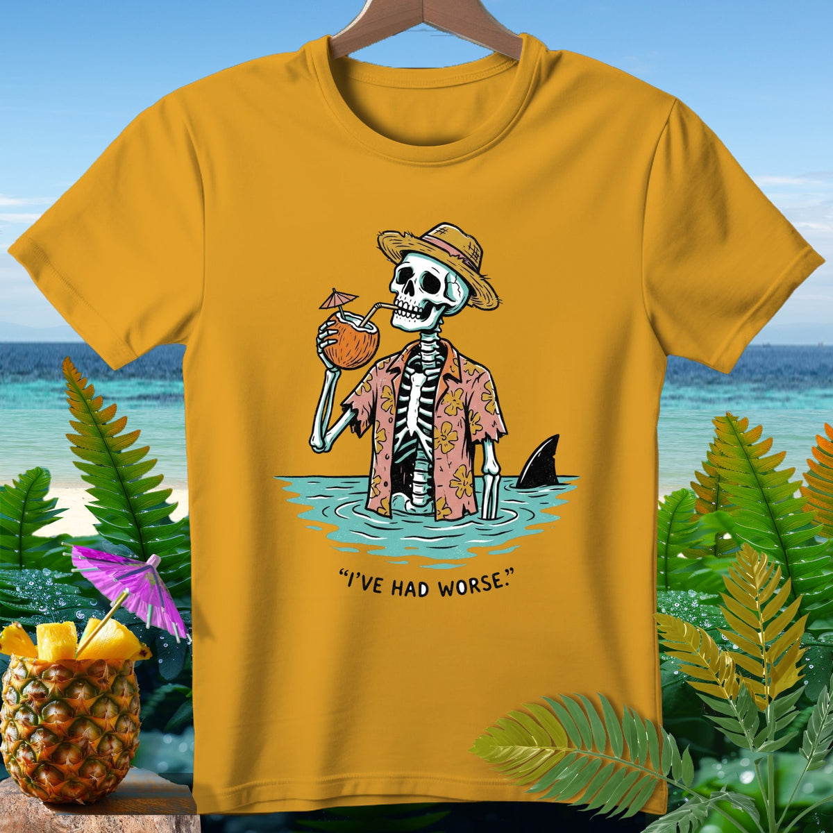 Skeleton in a Hawaiian shirt drinks from a coconut in the ocean with a shark fin nearby.