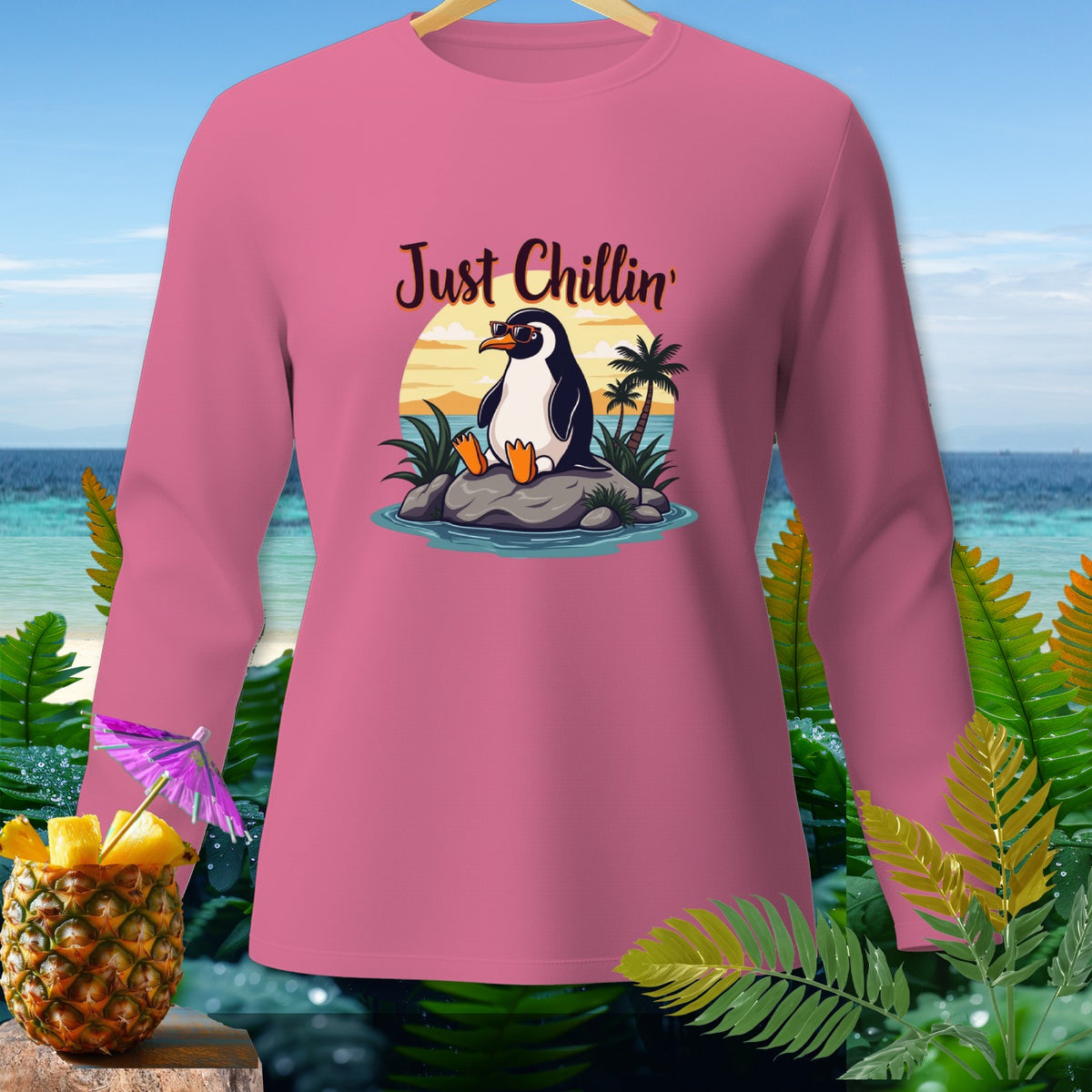 Pink long sleeve shirt with "Just Chillin'" text and a penguin graphic.