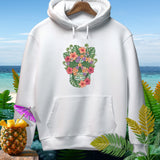 White hoodie with floral skull graphic, pineapple, and tropical foliage.