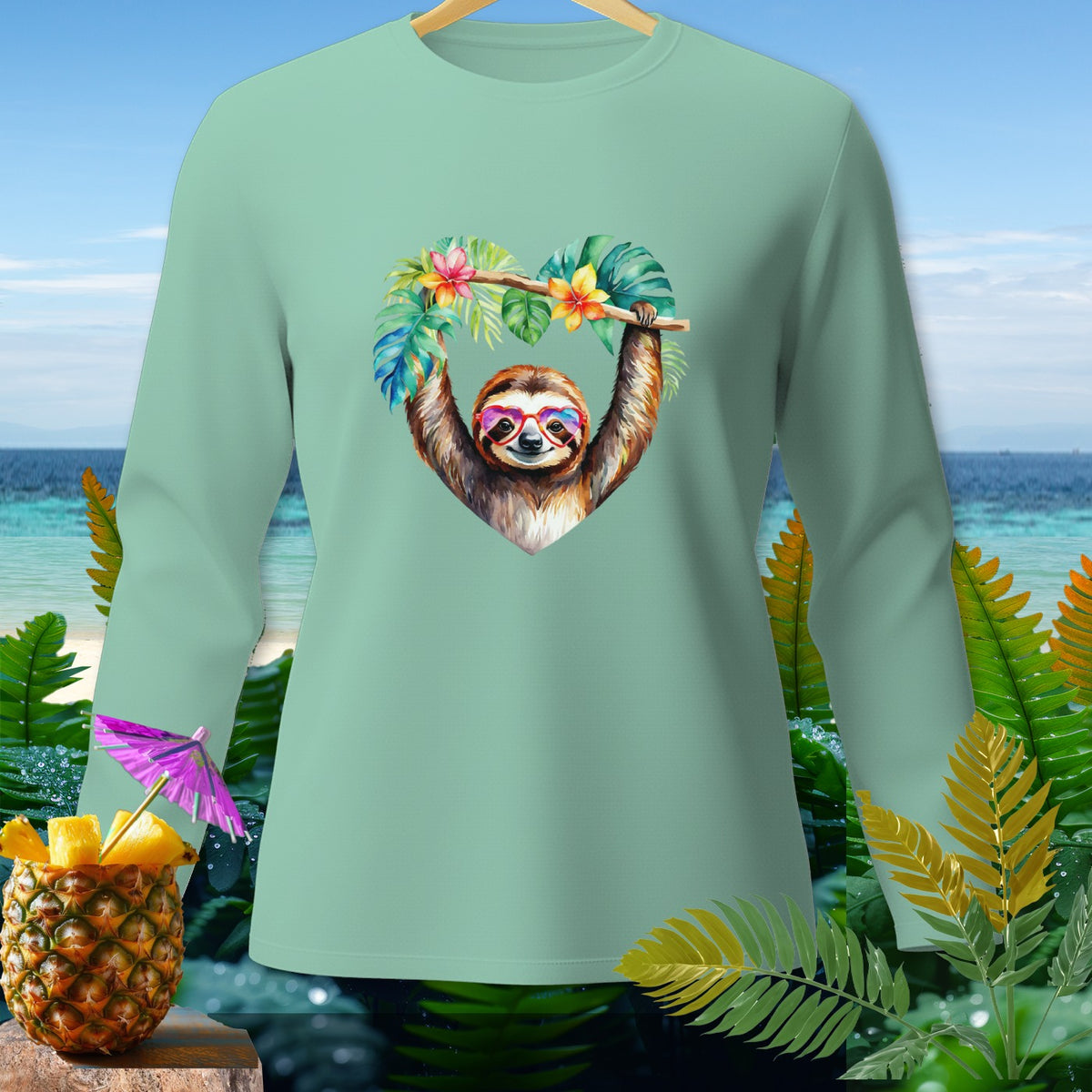 Long-sleeved shirt with a heart-shaped sloth graphic and tropical elements.