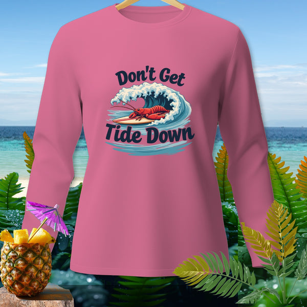 Pink long-sleeve shirt with lobster surfing graphic and text "Don't Get Tide Down".
