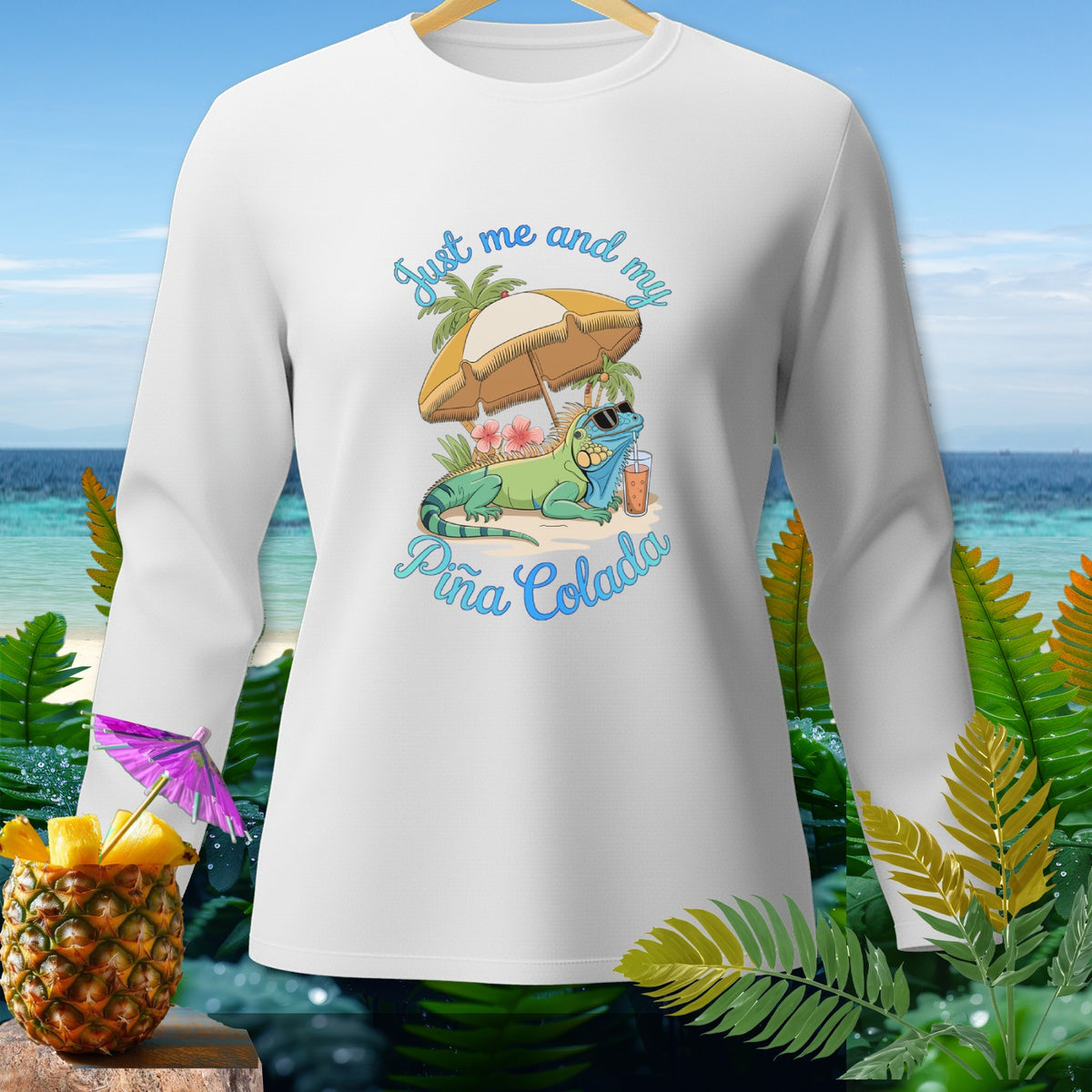 White long-sleeve shirt with iguana and "Just me and my Piña Colada" text.