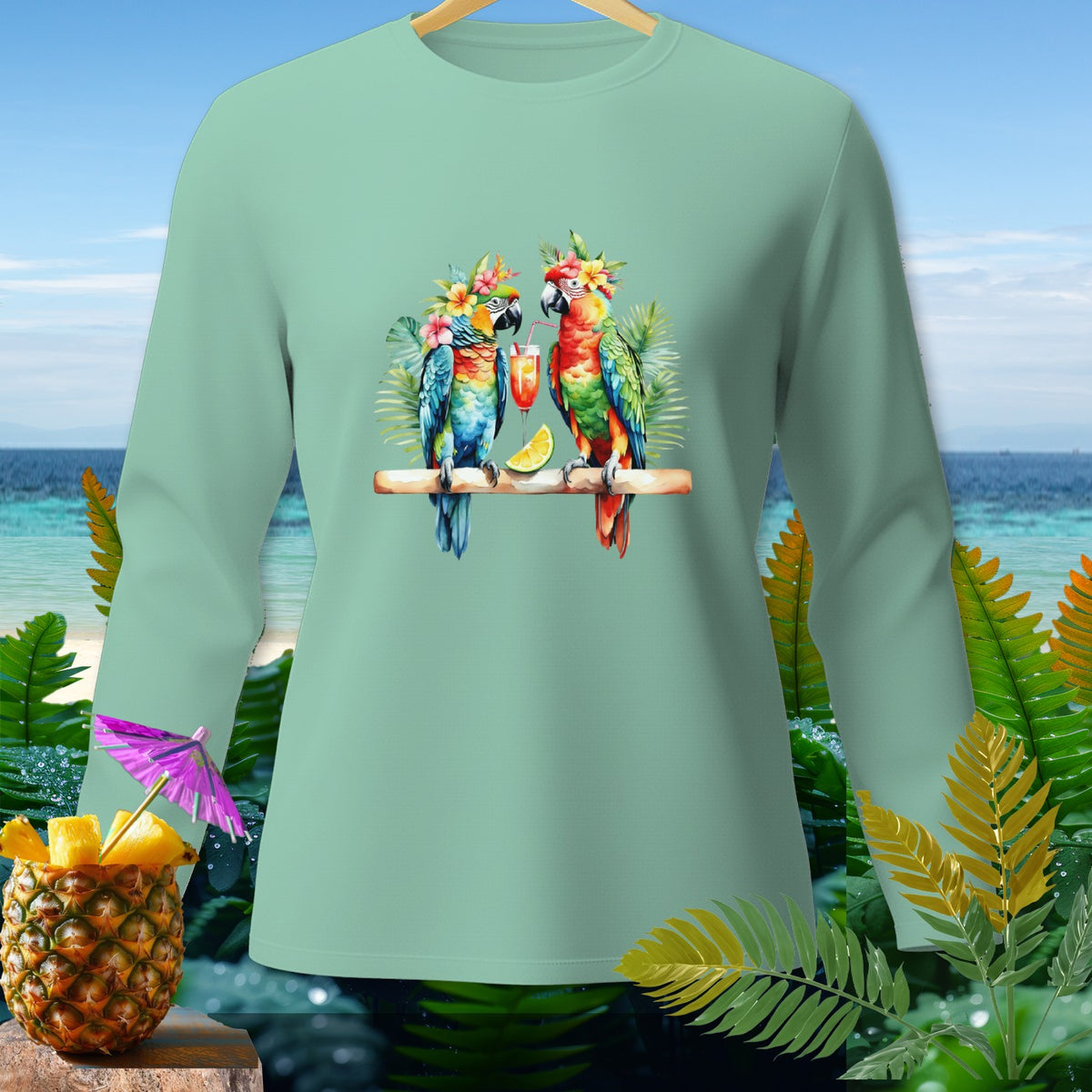 Mint green long-sleeve shirt with two macaws, cocktails, and a pineapple.