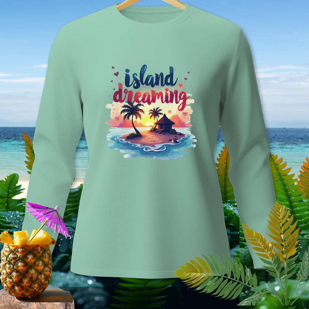 Long sleeve shirt with "island dreaming" text and tropical island graphic.