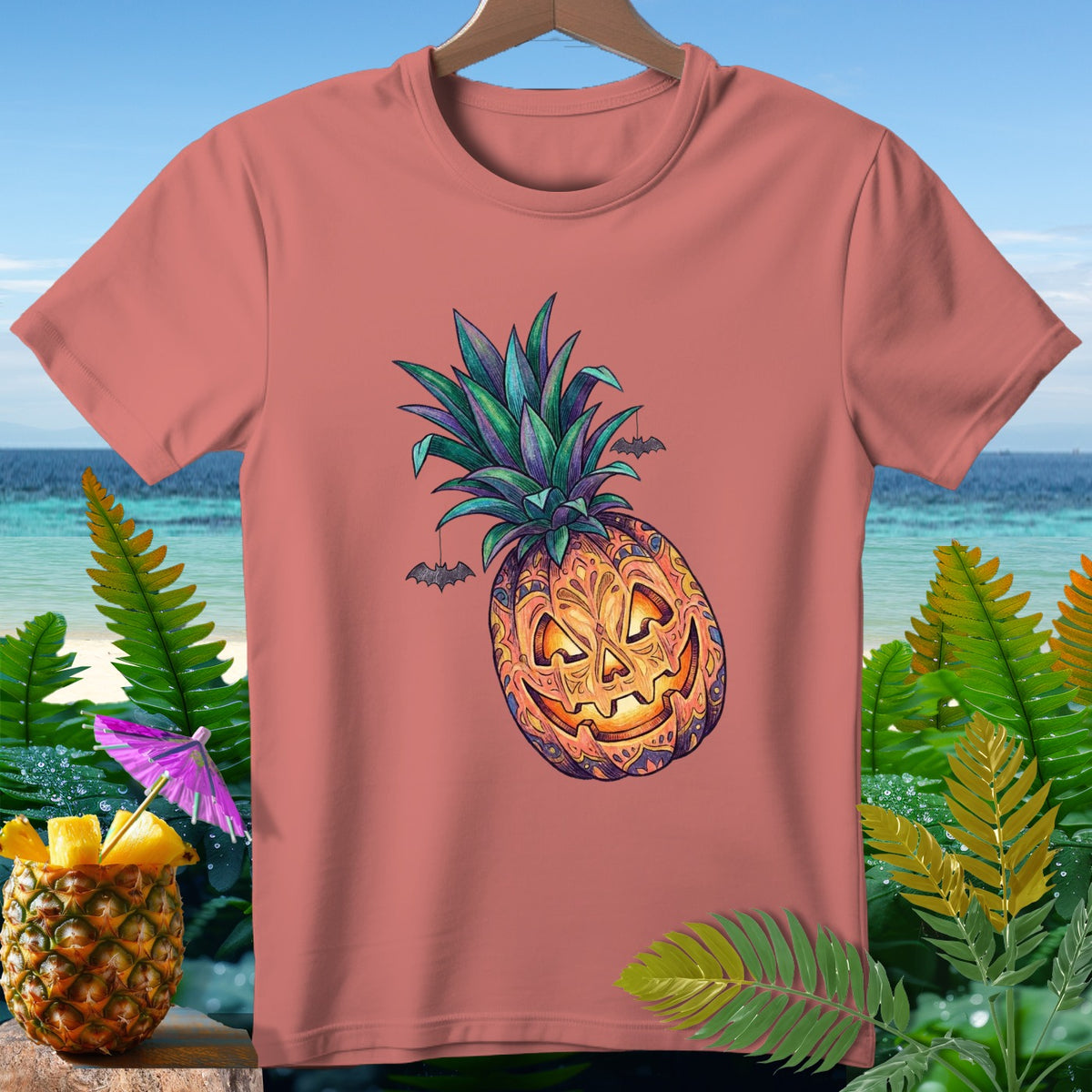 T-shirt with a jack-o'-lantern pineapple design and hanging bats.