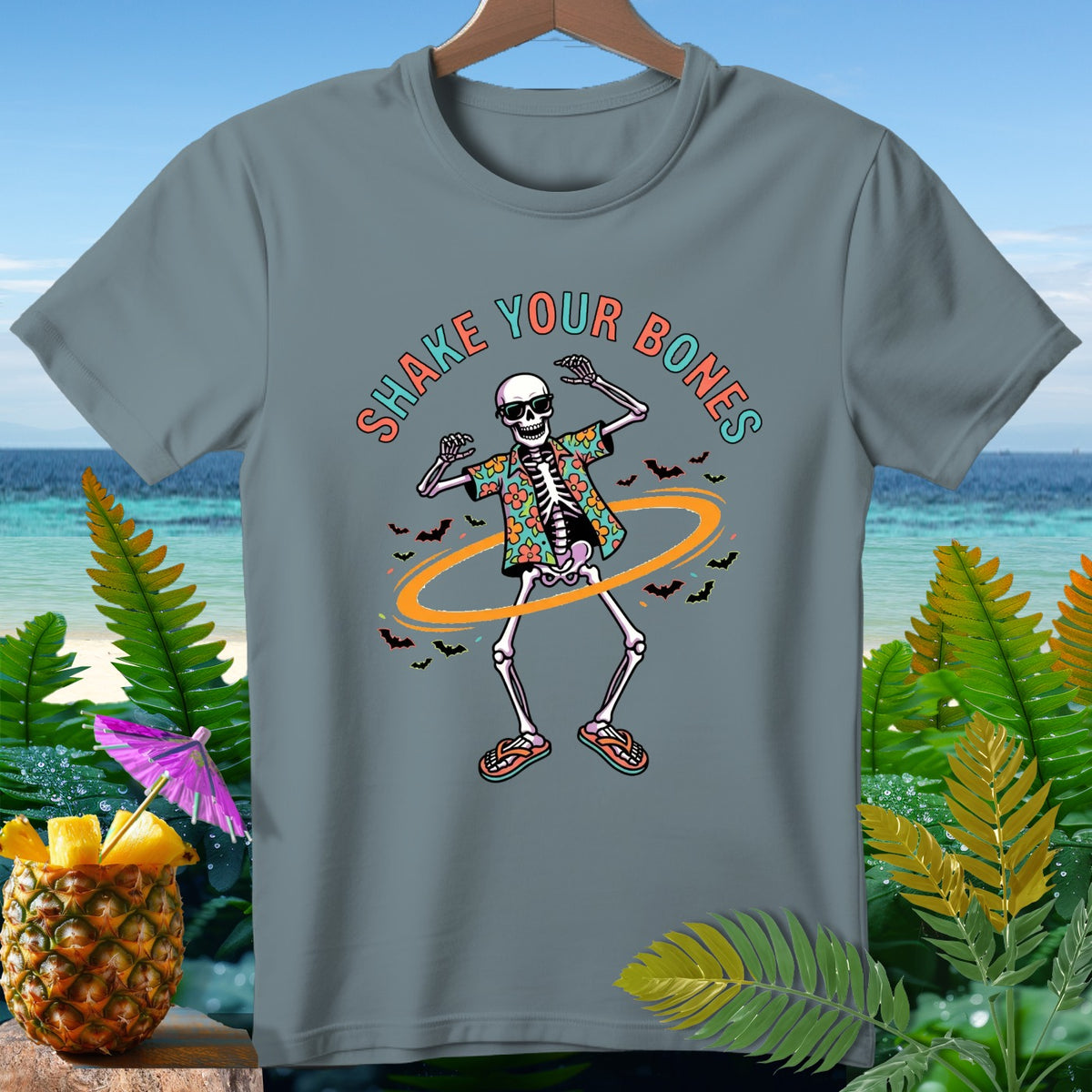 Skeleton wearing Hawaiian shirt and sunglasses, text "Shake Your Bones," and bats.