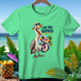 Green t-shirt with a pelican on a beach, saying 