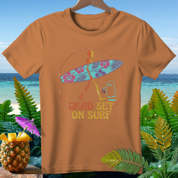 Skeleton carrying surfboard with ghost, text reads "DEAD SET ON SURF".