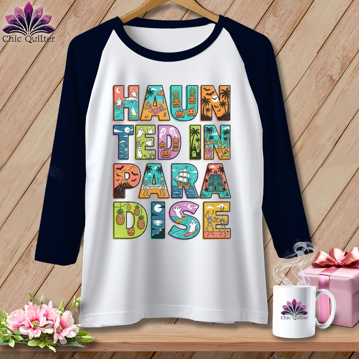 Raglan shirt with "Haunted in Paradise" text featuring Halloween and beach motifs.