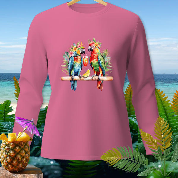 Pink long sleeve shirt with two parrots wearing flower crowns and holding drinks.