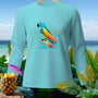 Light blue long-sleeve shirt with a colorful abstract parrot graphic.