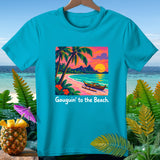 Turquoise t-shirt with a tropical beach sunset design and text 