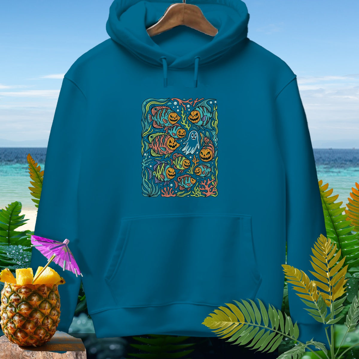 Teal hoodie with Halloween sea creature and pumpkin graphic on front.