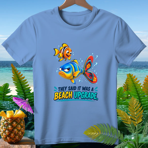 Blue t-shirt with cartoon fish and text "They Said It Was A Beach Upgrade".