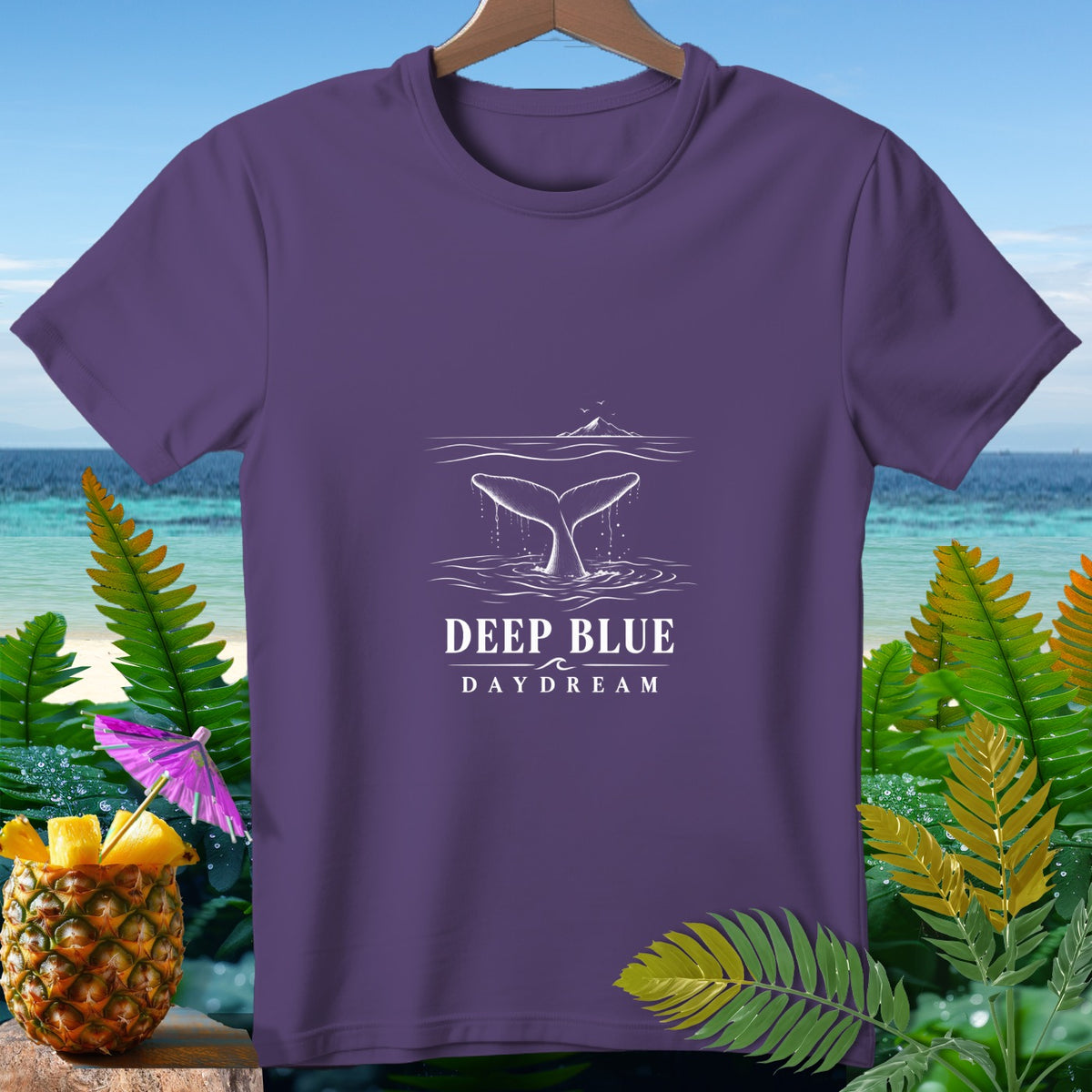 Purple t-shirt with white whale tail graphic and "DEEP BLUE DAYDREAM" text.