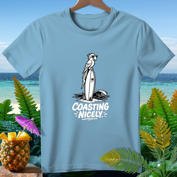 Light blue t-shirt with a parrot on a surfboard and the text "Coasting Nicely".