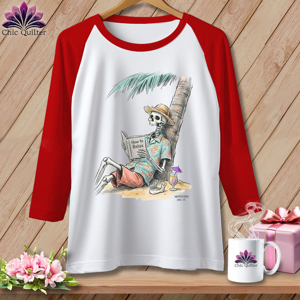 White raglan shirt with skeleton reading "How to Relax" by a palm tree.