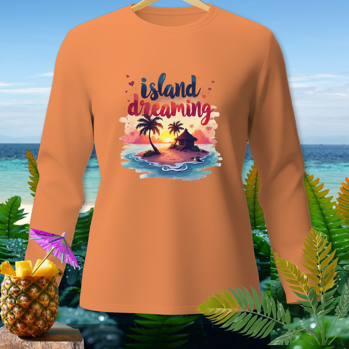 Orange long-sleeve shirt with "island dreaming" graphic and tropical scene.