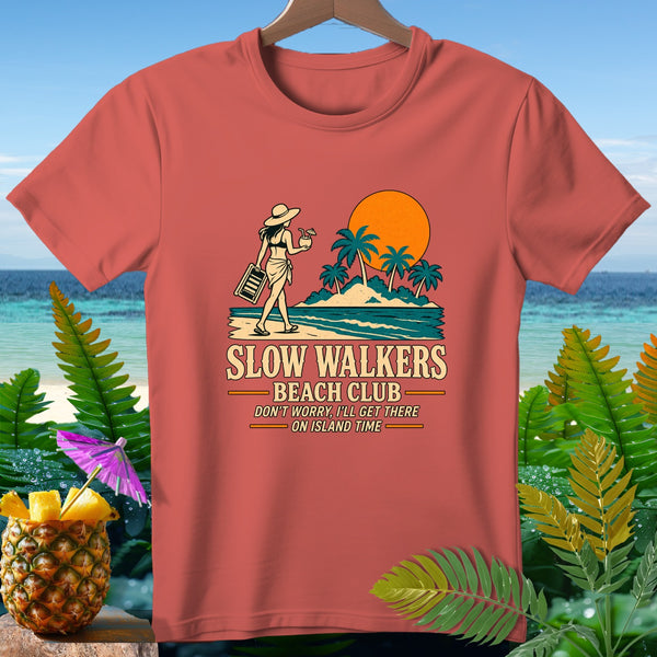 Peach t-shirt with "Slow Walkers Beach Club" graphic of woman on beach.