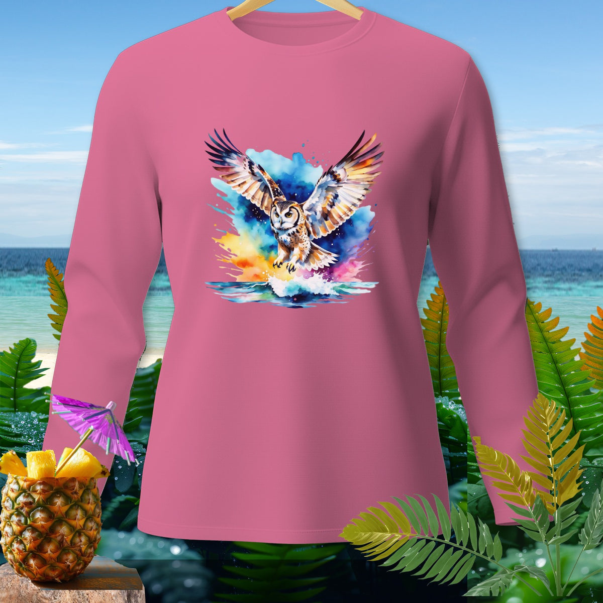 Pink long-sleeve shirt with watercolor owl flying over water graphic.