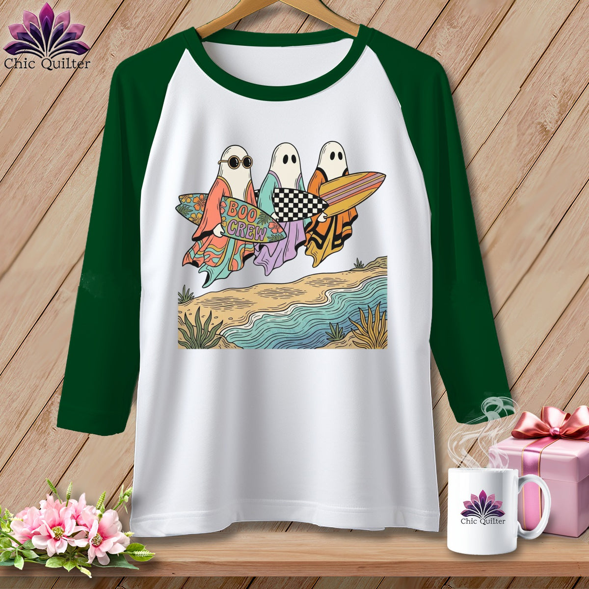 White raglan shirt with ghosts holding surfboards on a beach with "Boo Crew" text.