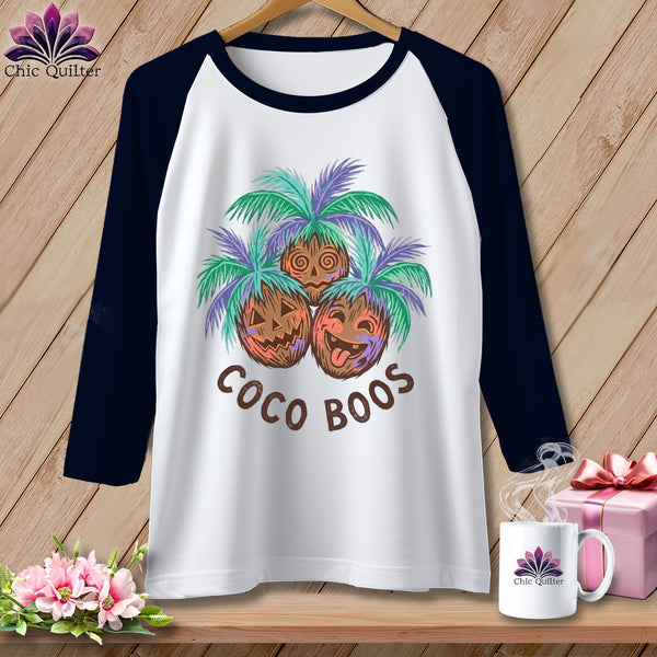 White raglan shirt with three jack-o'-lantern coconuts and "Coco Boos" text.