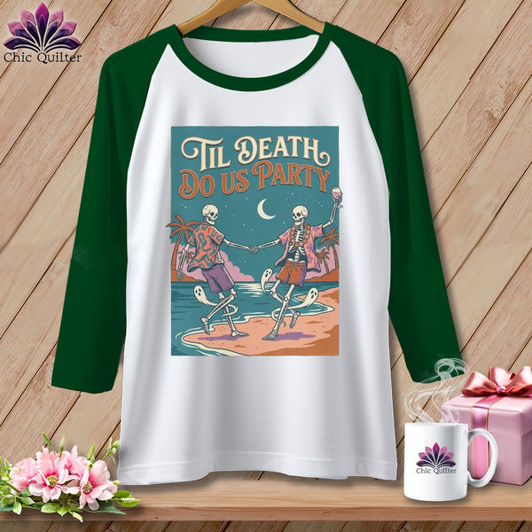 White raglan sleeve shirt with skeletons dancing on a beach and the text "Til Death Do Us Party."