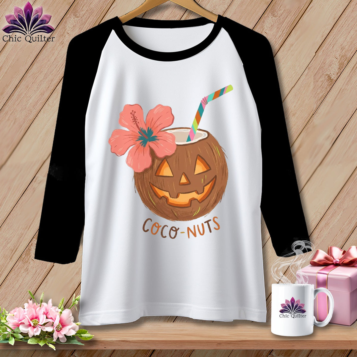 Black and white baseball tee with a jack-o'-lantern coconut, hibiscus flower, and "Coco-Nuts" text.