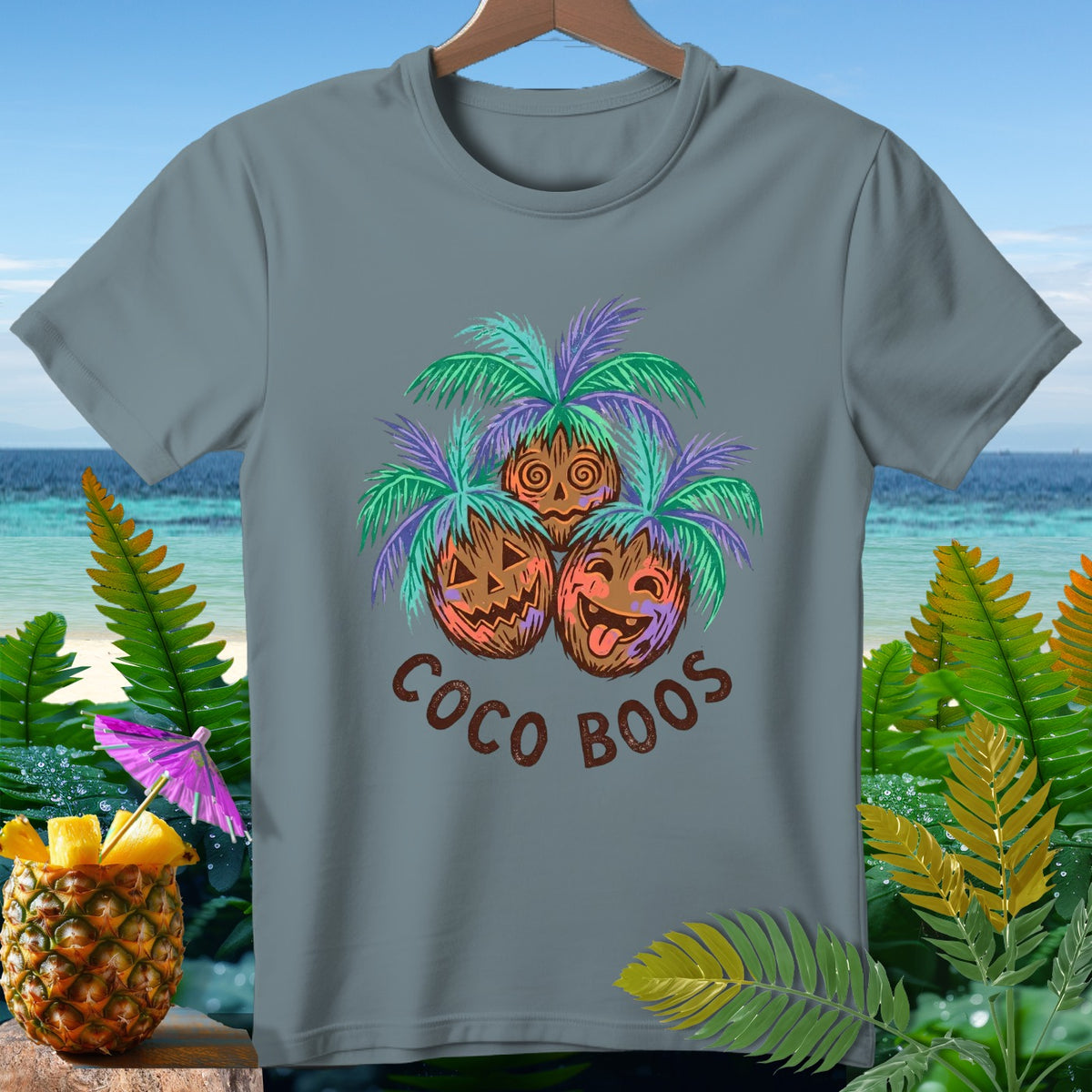 T-shirt with "Coco Boos" text and carved coconuts with palm trees.