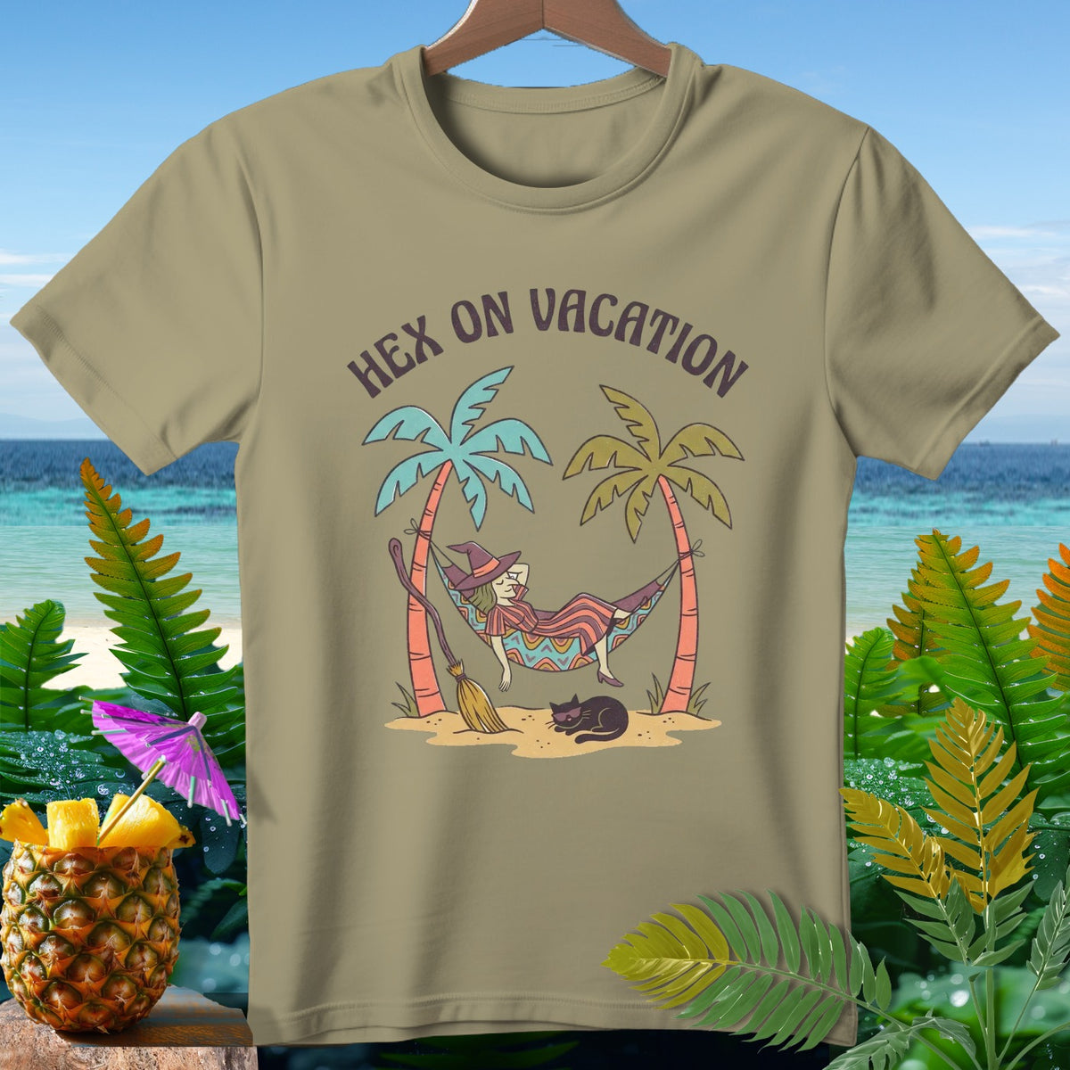 T-shirt graphic of a witch in a hammock with text "Hex on Vacation".