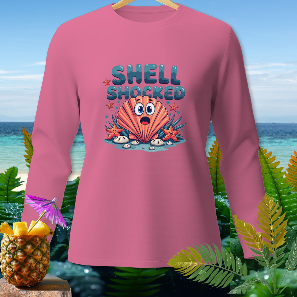Pink long-sleeve shirt with "Shell Shocked" text and cartoon seashell.