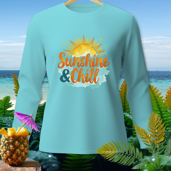Light blue long-sleeve shirt with "Sunshine & Chill" graphic and sun on a tropical beach background.