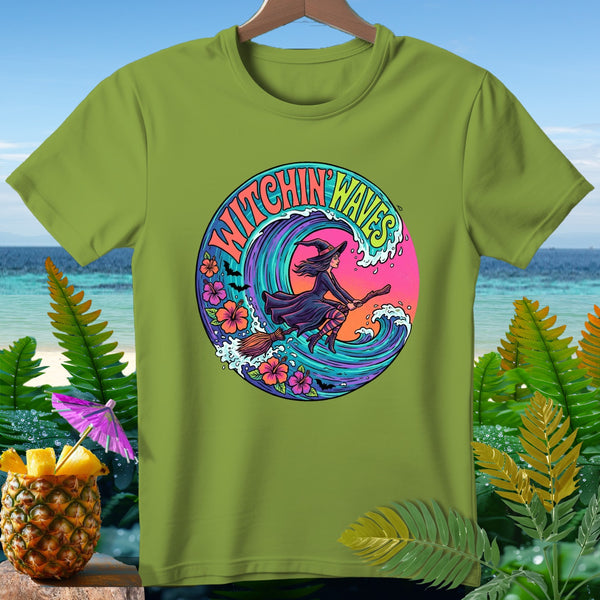 Green t-shirt with "Witchin' Waves" circular graphic of witch flying on broomstick through waves.
