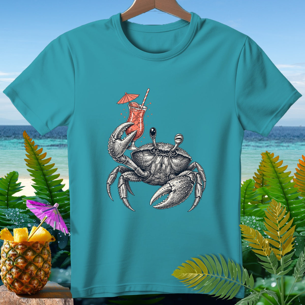 Crab holding a cocktail on a teal t-shirt with tropical background.