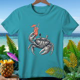 Crab holding a cocktail on a teal t-shirt with tropical background.