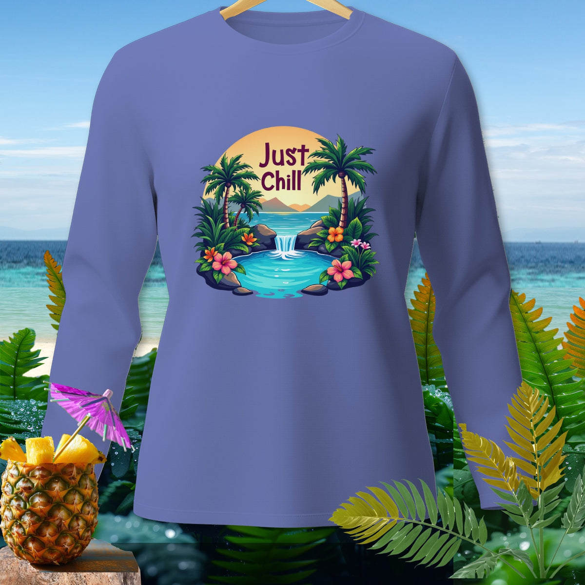 Purple long-sleeve shirt with "Just Chill" text and tropical waterfall scene graphic.