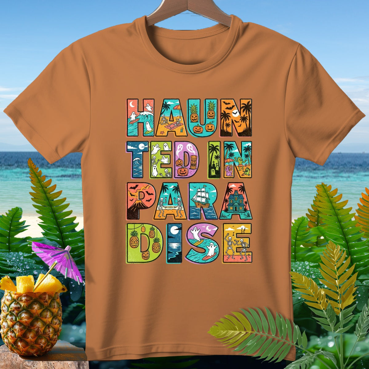 Orange t-shirt with "Haunted In Paradise" text in colorful, illustrated letters.