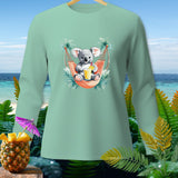 Mint long sleeve shirt with a cartoon koala relaxing in a hammock.