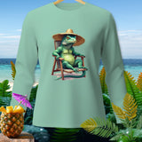 Light green long-sleeve shirt with a green iguana wearing a straw hat relaxing in a beach chair.